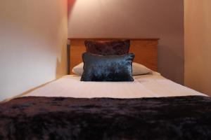 A bed or beds in a room at Bridge Hotel
