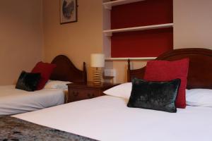 A bed or beds in a room at Bridge Hotel