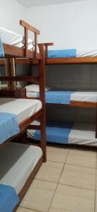 a group of four bunk beds in a room at Hostel Cidade Nova in Rio de Janeiro +52 photos
