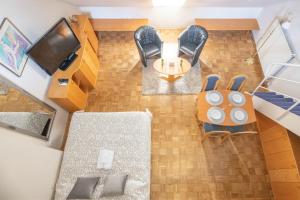 an overhead view of a living room with a table and chairs at Apartments Vila Golf - Flucher Turizem in Rogaška Slatina