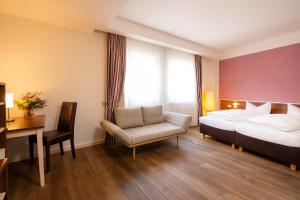 Postel nebo postele na pokoji v ubytování BEHLs Genusshotel im Brennhaus