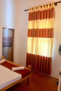 Postel nebo postele na pokoji v ubytování Chipmunk Home Stay