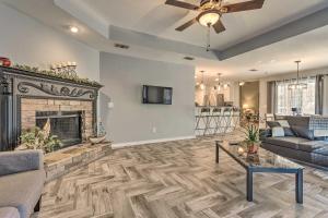 a living room with a fireplace and a couch at Private Gulf Breeze Gem with Easy Shore Access! in Navarre