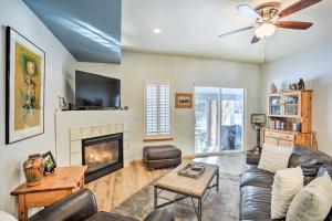 a living room with a couch and a fireplace at Cozy Vail Valley Townhome - Walk to Riverwalk! in Edwards