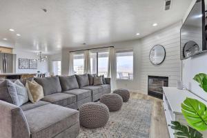 a living room with a couch and a fireplace at Luxe Family Condo with Mtn View and Resort Perks! in St. George