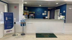 a counter in a store with a cash register at Quality Inn & Suites in Edgefield