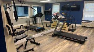 a gym with several tread machines in a room at Quality Inn & Suites in Edgefield