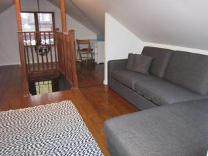 a living room with a couch and a table at Beautiful apartment close to lake Mälaren in Södertälje