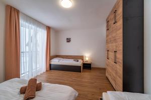 Giường trong phòng chung tại Apartmán na Bukovce MALMA