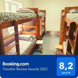a room with several bunk beds in a room at Uman Welcome Hostel in Umanʼ