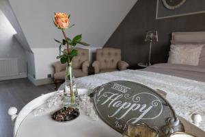 Postel nebo postele na pokoji v ubytování Tussen Hemel en Maas