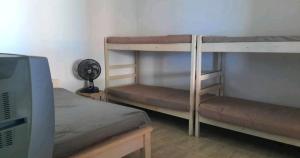 Ένα ή περισσότερα κρεβάτια σε δωμάτιο στο Casa de praia em Ilha Comprida