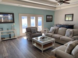 a living room with a couch and a coffee table at Hidden Beach Oasis in Myrtle Beach