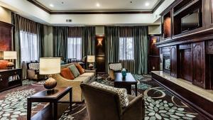 a living room with a couch and a television at Staybridge Suites Laredo, an IHG Hotel in Laredo