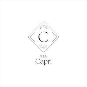 un symbole de capricorn avec la lettre c dans l'établissement Capri B&B, à Bolzano