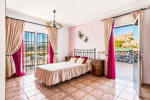 Posteľ alebo postele v izbe v ubytovaní Villa Sol Nerja