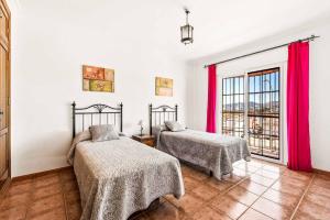 Posteľ alebo postele v izbe v ubytovaní Villa Sol Nerja