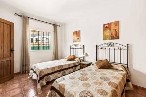 Posteľ alebo postele v izbe v ubytovaní Villa Sol Nerja
