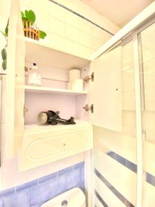 a bathroom with a toilet and a shower at Comfortable studio old town, parking optional in Seville