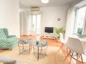 A television and/or entertainment centre at SuperB Apartment in downtown of Sevilla ,parking optional, Top !!