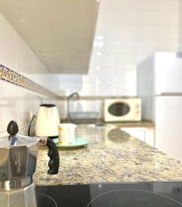 A kitchen or kitchenette at SuperB Apartment in downtown of Sevilla ,parking optional, Top !!