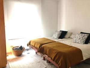 Łóżko lub łóżka w pokoju w obiekcie Apartamento Bahía Jardín
