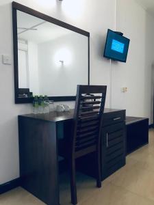 TV a/nebo společenská místnost v ubytování Ravan Resort Tangalle