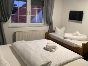 Кровать или кровати в номере Berghotel Sülbeck