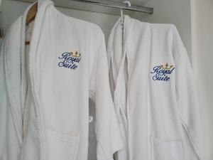 a group of white shirts hanging on a rack at casaenjoysamana in Los Naranjos