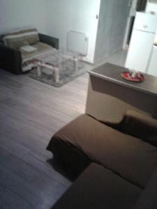 a living room with a couch and a table at superbe t2 centre de cognac in Cognac