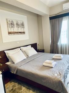 Postel nebo postele na pokoji v ubytování Rodon Guesthouse