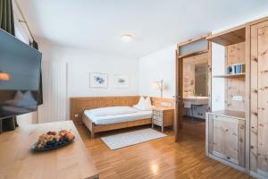 Rúm í herbergi á Felbermayer Hotel & AlpineSpa-Montafon
