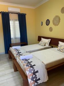 Postel nebo postele na pokoji v ubytování Havana Hôtel