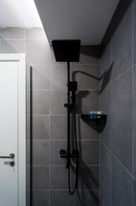 a shower with a shower head in a bathroom at "Craft Room", Twins #129, new gudauri in Gudauri