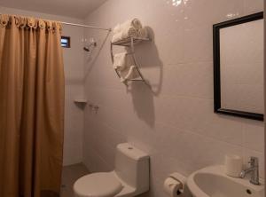 a bathroom with a toilet and a sink at WAKAYA ECOLODGE in Pucallpa +31 photos