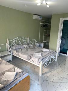Cama o camas de una habitación en "Рояль" Гостевой дом