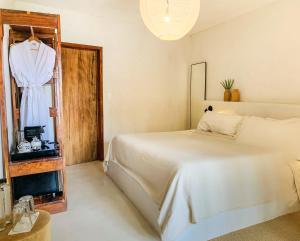 Una cama o camas en una habitación de Dune Boutique Hotel located at the party zone