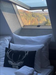 a bed with pillows and a window in a train at Willa Spa Scaliano in Kudowa-Zdrój +89 photos