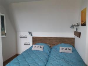 Ένα ή περισσότερα κρεβάτια σε δωμάτιο στο Relais équestre du Miloir - chambres d'hôtes