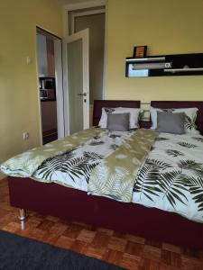 a large bed in a room with at Apartman Dominik in Zagreb