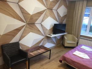 a room with a wall with a geometric design at APARTHOTEL BON BON in Sofia