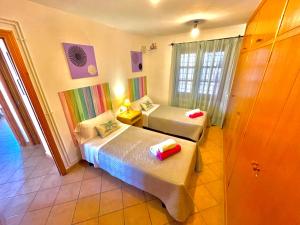 a hotel room with two beds and a window at es cau in Manacor +16 photos