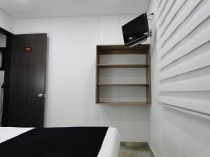 TV a/nebo společenská místnost v ubytování Hotel Esmeralda Plaza