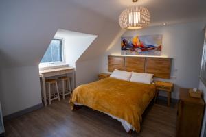 a bedroom with a bed and a desk and a window at Magnolia House, Rye in Rye