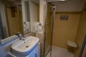 a bathroom with a sink and a shower at Magnolia House, Rye in Rye