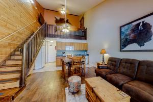 a living room with a couch and a table at Buffalo Beauty in Granby