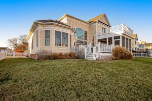 a large house with a lawn in front of it at Bethany Lakes --- 31302 Terry Circle in Bethany Beach