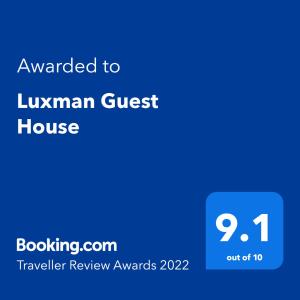 a blue text box with the text awarded to lugman guest house at Luxman Guest House in Polonnaruwa