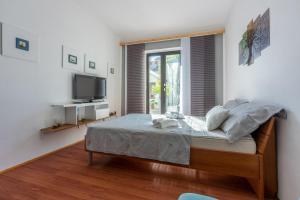 Posteľ alebo postele v izbe v ubytovaní House Sunshine