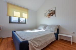 Posteľ alebo postele v izbe v ubytovaní House Sunshine